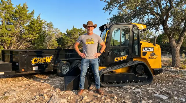 CHEW owner with JCB track loader and branded trailer